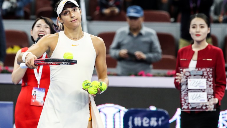 Garbiñe Muguruza y Carla Suárez pasan ronda en el WTA de Beijing